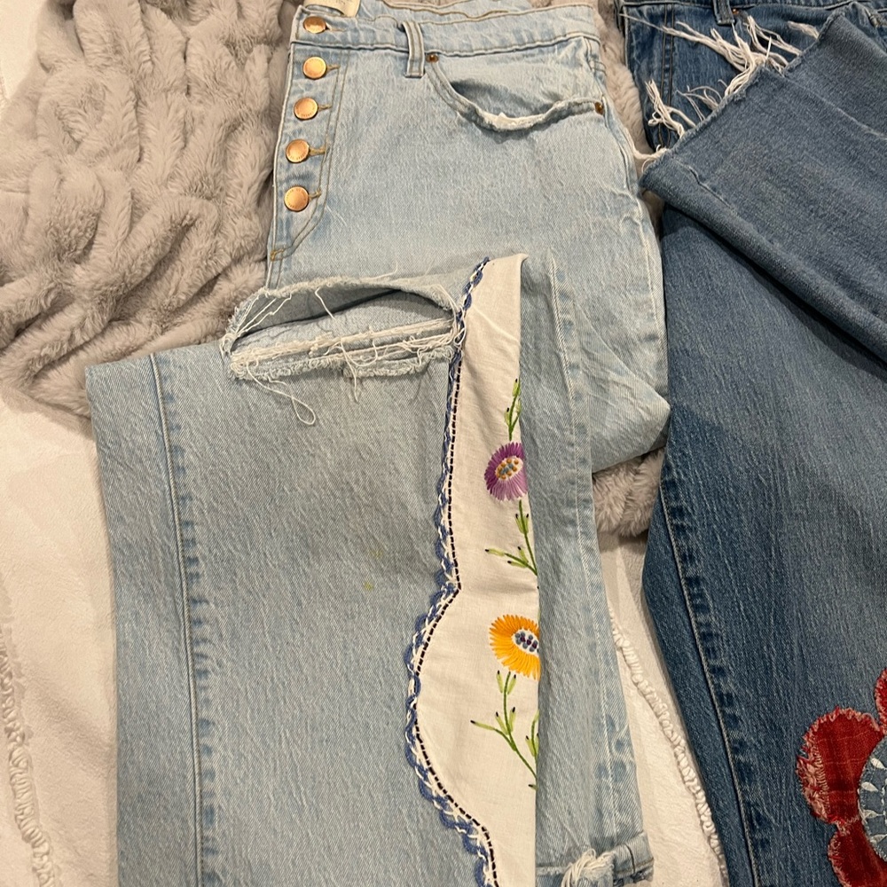 Jeans with vintage embroidered tablecloth.